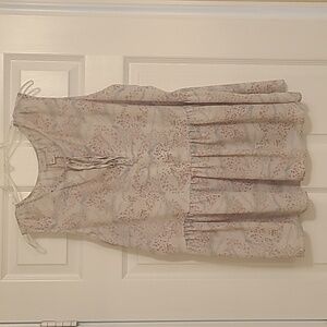 Floral babydoll/peplum style sleeveless blouse